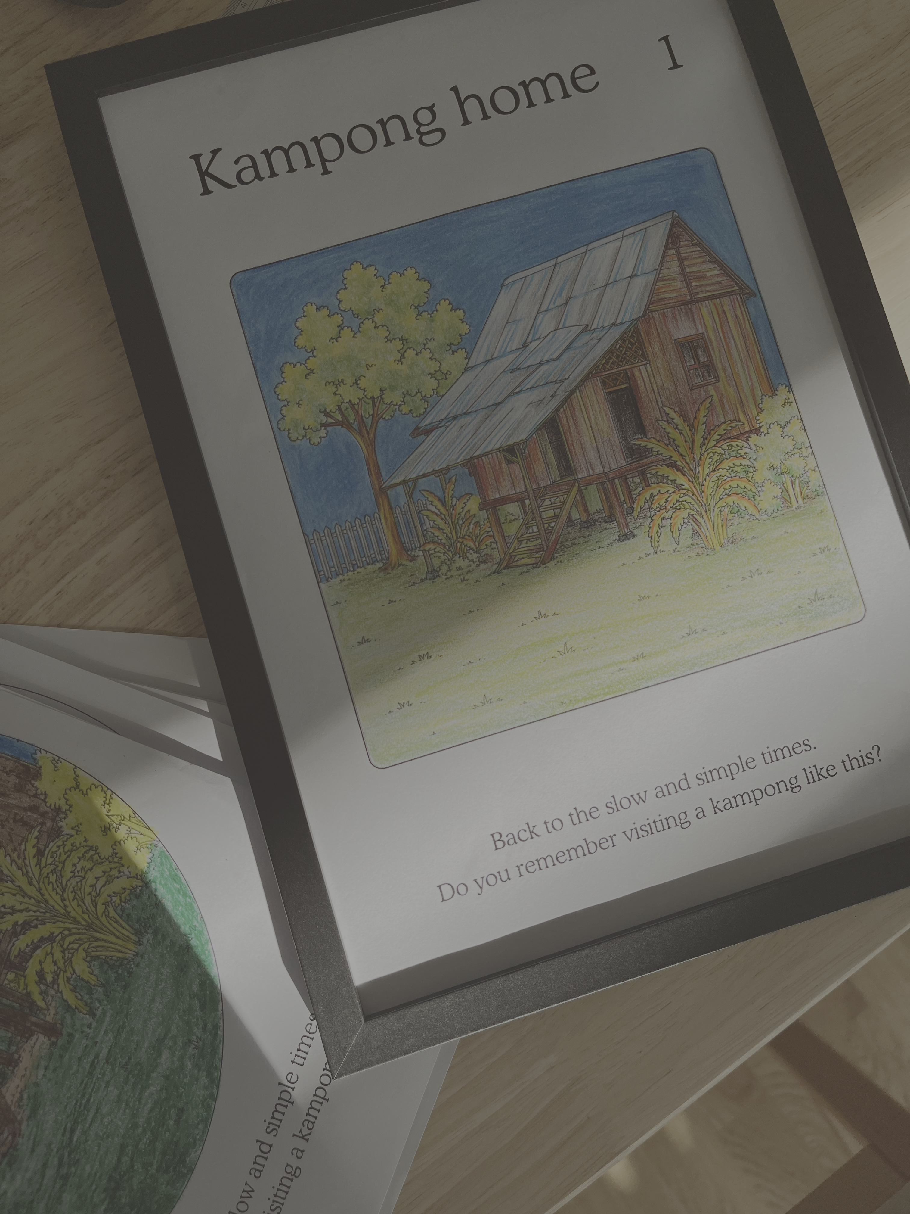 Illustration of a house labeled 'Kampong home' on a book page.